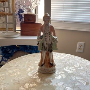 vintage pastel green and orange colonial man porcelain like statue decor